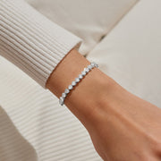 Silver crystal slider bracelet styled on wrist, showing brilliant stones and sleek adjustable chain for perfect fit.

