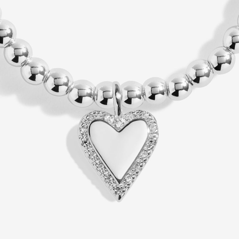 Close-up of Joma Jewellery With Love bracelet heart charm