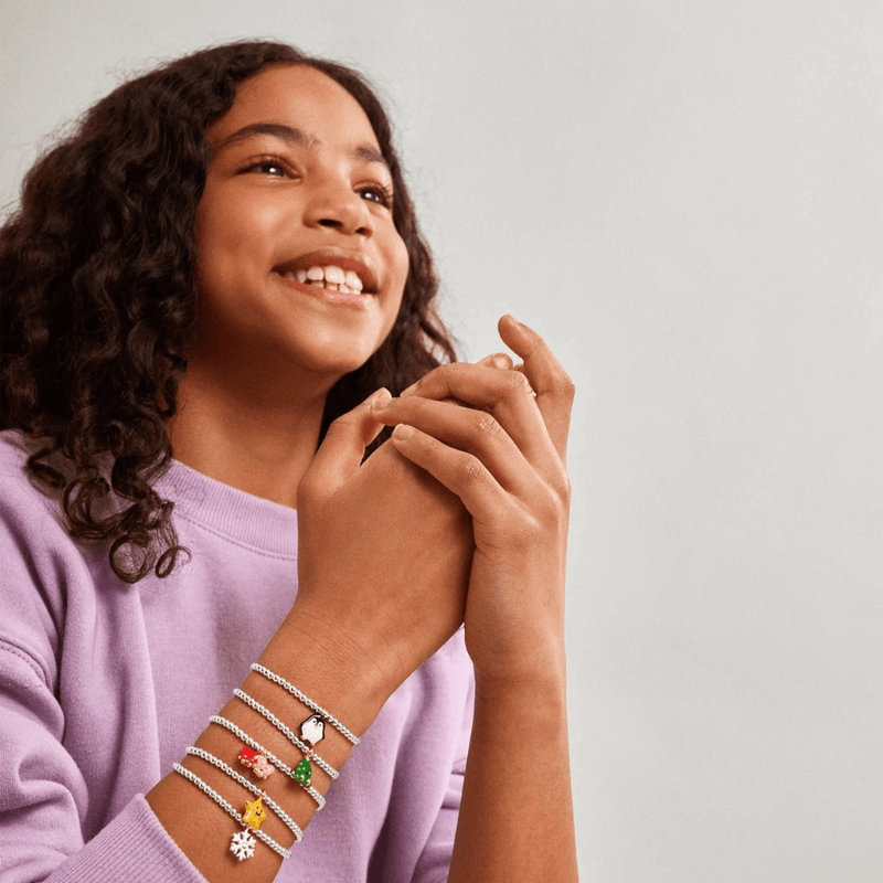 Joma Jomees penguin bracelet worn with kids character bracelets