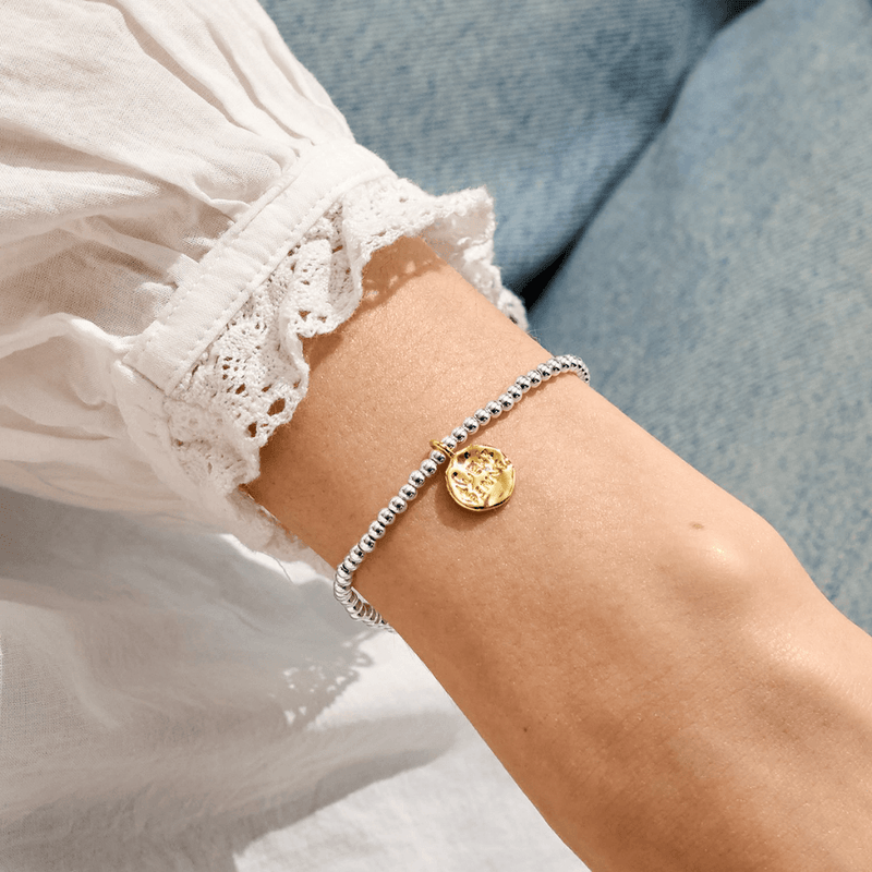Joma Jewellery Lucky Penny bracelet worn on the wrist