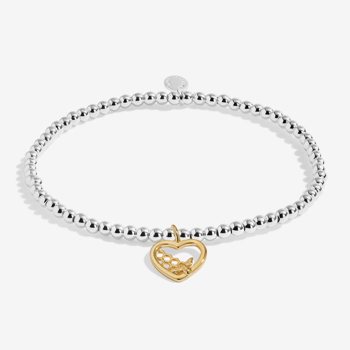 Joma stretch Bracelet with silver beads and gold bee heart charm displayed on a white background