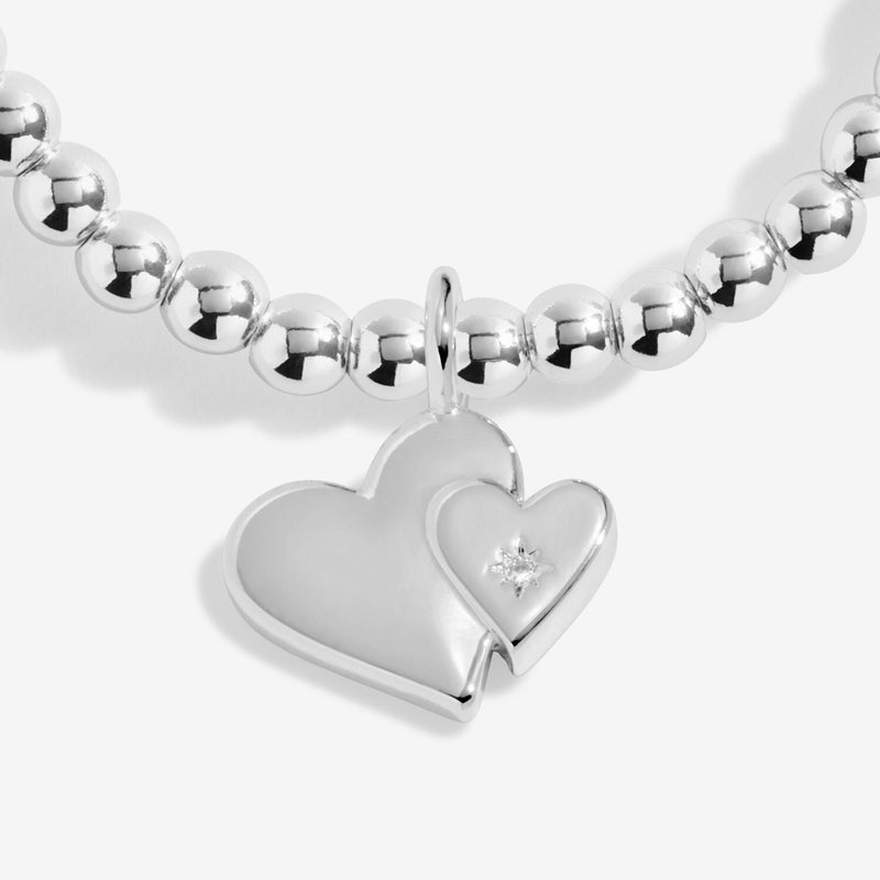 Close-up of Joma Mother & Daughter bracelet double heart charm