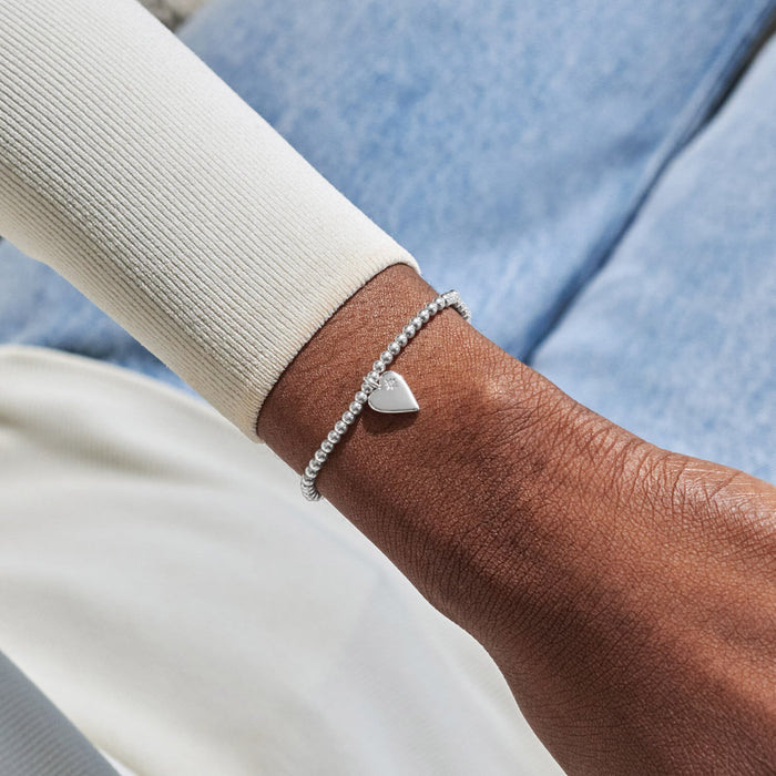 Silver-plated Joma Jewellery beaded Bracelet worn on wrist with heart charm and tiny star detail, Mum always loved forever missed Bracelet.