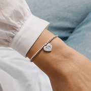 Joma Jewellery Little Bundle Of Joy bracelet worn on an adult wrist
