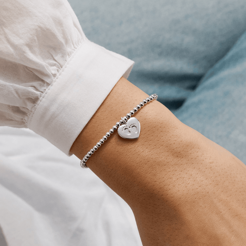 Joma Jewellery Little Bundle Of Joy bracelet worn on an adult wrist