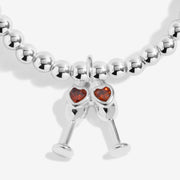 Close-up of Joma Sip Sip Hooray bracelet champagne charm