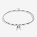 Joma silver-plated stretch Bracelet with champagne glasses charm shown on a white background