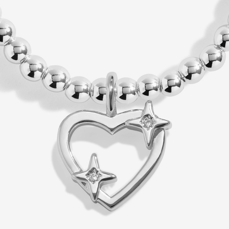 Close-up of the sparkling starry heart charm on the Joma Super Sister Bracelet