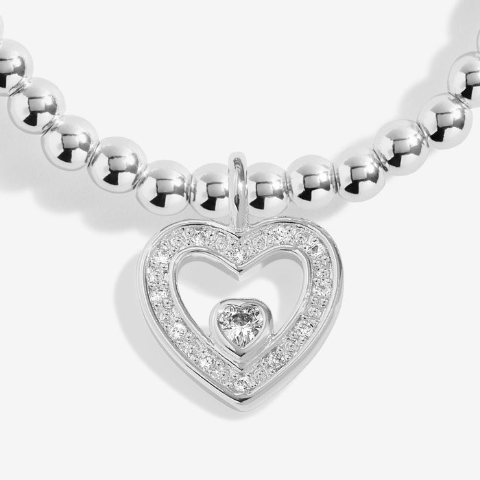 Close-up of open heart charm with crystal details on silver-plated beaded Bracelet