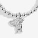 Close-up of teddy bear charm holding sparkling heart on silver-plated beaded Bracelet