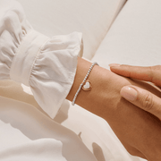 Joma Jewellery With Love Always heart bracelet worn on a wrist