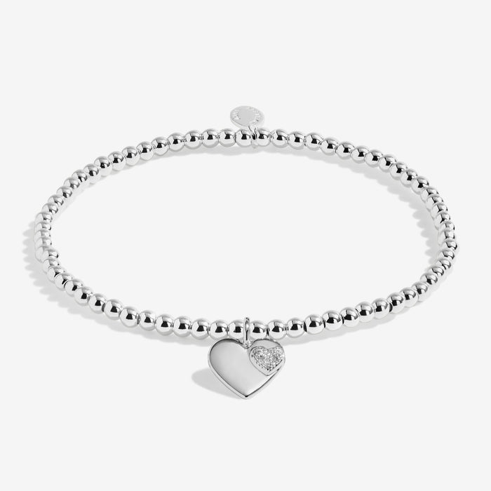 Full view of Joma Jewellery A Little Wonderful Gran Bracelet, silver-plated beaded stretch Bracelet with heart charm and sparkle detail.