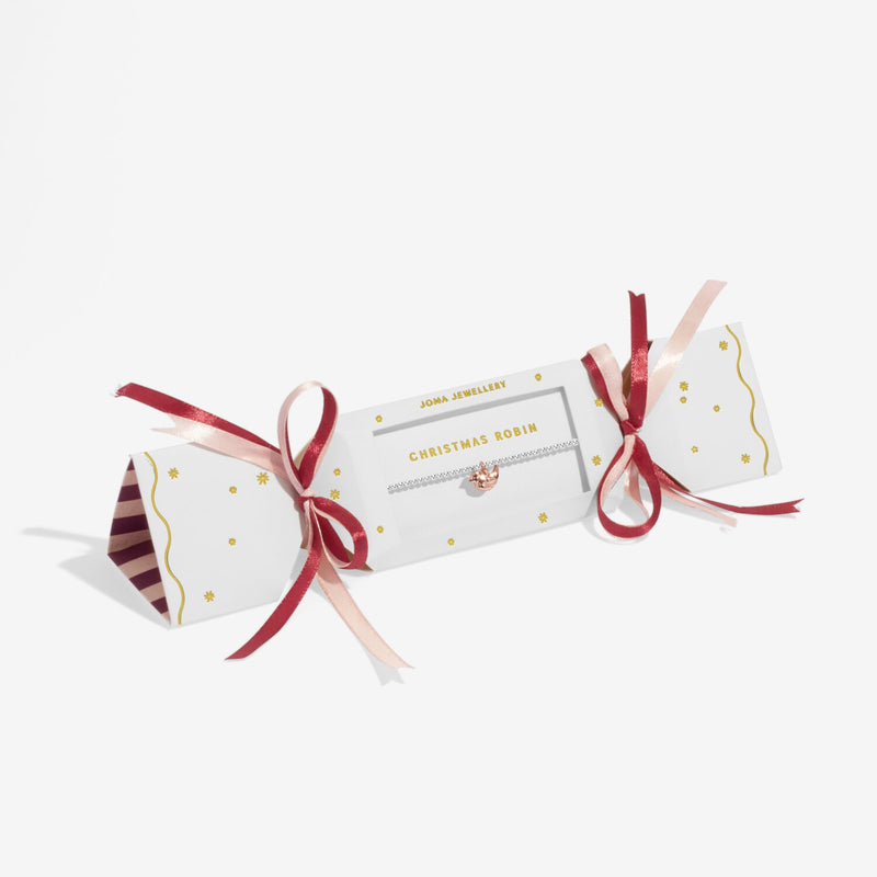 White and burgundy cracker gift box presenting Joma Jewellery Christmas Robin charm bracelet for seasonal gifting.

