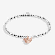 Joma Jewellery Christmas Robin silver beaded bracelet with rose‑gold robin charm, product shot on white background.
