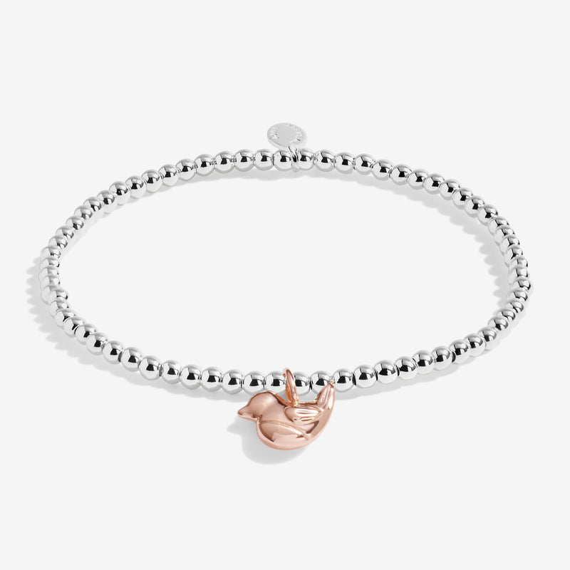 Joma Jewellery Christmas Robin silver beaded bracelet with rose‑gold robin charm, product shot on white background.
