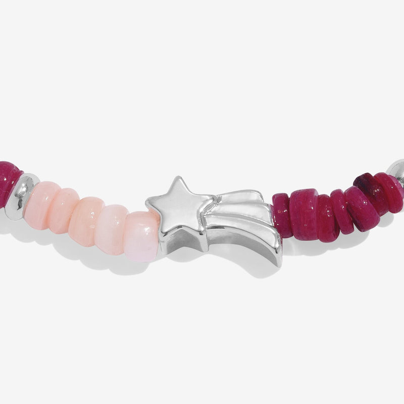 Close-up of Joma Christmas Wish bracelet shooting-star bead