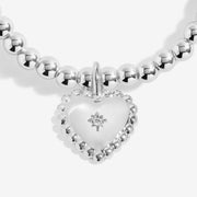 Close‑up of heart charm with star on Joma Jewellery beaded bracelet – perfect Christmas gifts for kids, women, gifts for her.