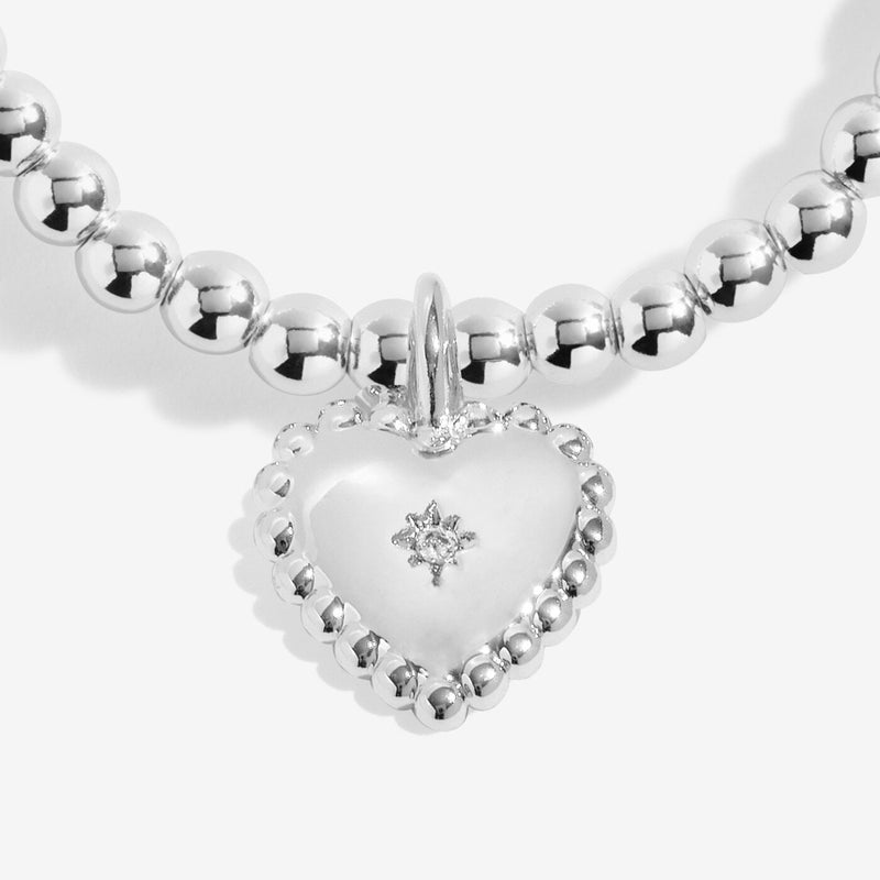Close‑up of heart charm with star on Joma Jewellery beaded bracelet – perfect Christmas gifts for kids, women, gifts for her.