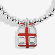 Close-up of Joma Happy Christmas bracelet red present charm