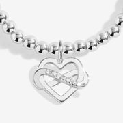 Close‑up infinity heart charm on Joma Jewellery silver bead bracelet – sparkling bracelets, ideal gifts for women.
