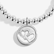 Close‑up of interlinked crystal heart charm on Joma Jewellery bracelet – elegant Joma bracelets, perfect gifts for women.
