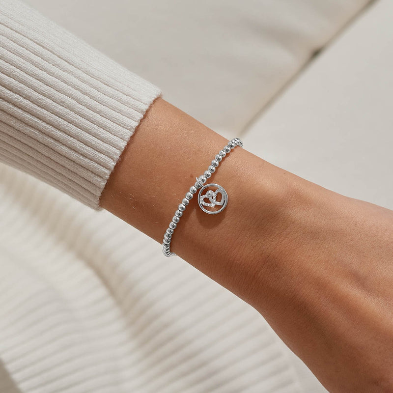 Love & Friendship heart bracelet by Joma Jewellery styled on wrist – chic silver bracelets, memorable gifts for women.

