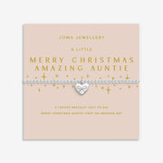 Display card for A Little “Merry Christmas Amazing Auntie” bracelet – blush backdrop with gold stars and loving greeting.