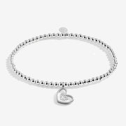 Joma Jewellery A Little “Merry Christmas Wonderful Grandma” bracelet – silver beaded band with double‑heart charm.
