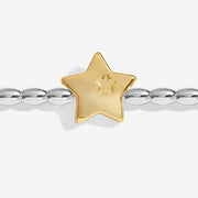 Close-up of Joma Merry Christmas bracelet gold star charm