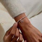 Joma Merry Christmas Super Sister bracelet worn on wrist