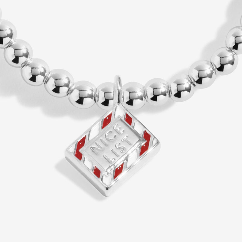 Close-up of Joma Nice List bracelet charm