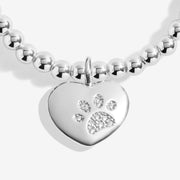 Close‑up of sparkling paw‑print heart charm on Joma Jewellery bracelet – perfect pet‑lover bracelets, gifts for women.
