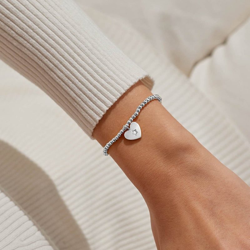 Joma Peace Love Joy bracelet worn on wrist