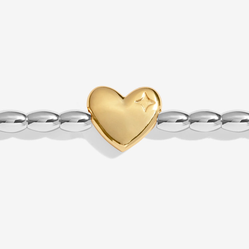 Close-up of Joma Season To Sparkle bracelet gold heart charm