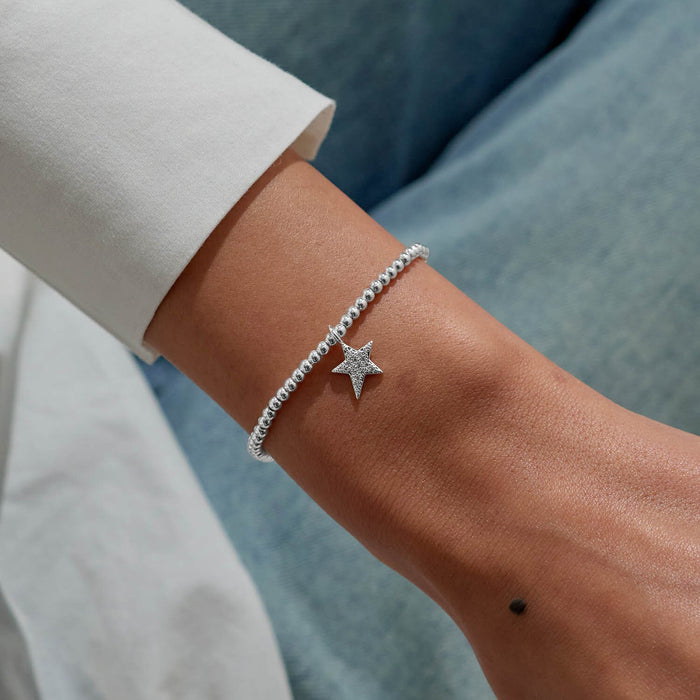 Pavé star charm bracelet by Joma Jewellery styled on wrist – chic silver bracelets and standout gifts for women.

