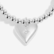 Close-up of Joma Love You Daughter bracelet heart charm