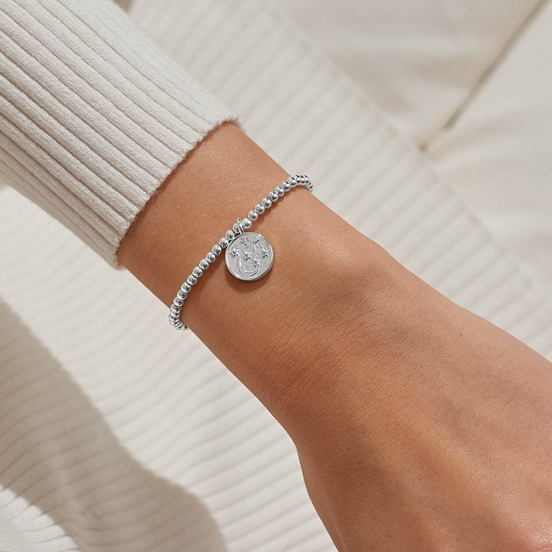 Joma Jewellery celestial charm bracelet worn on wrist