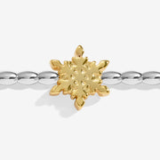 Close-up of Joma Winter Wishes bracelet gold snowflake charm