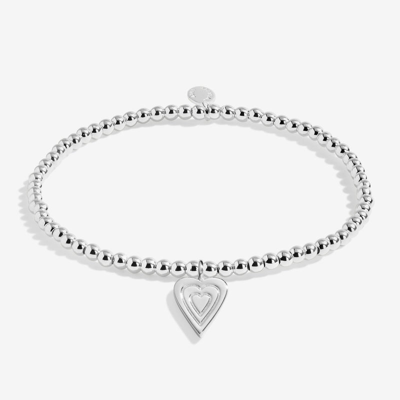 Joma Jewellery With Love silver beaded bracelet with layered heart charm, cut‑out on white background.
