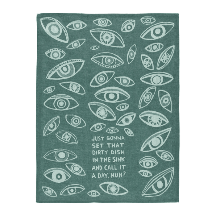 Full view of teal woven cotton tea towel with all-over eye pattern and dirty dish slogan.