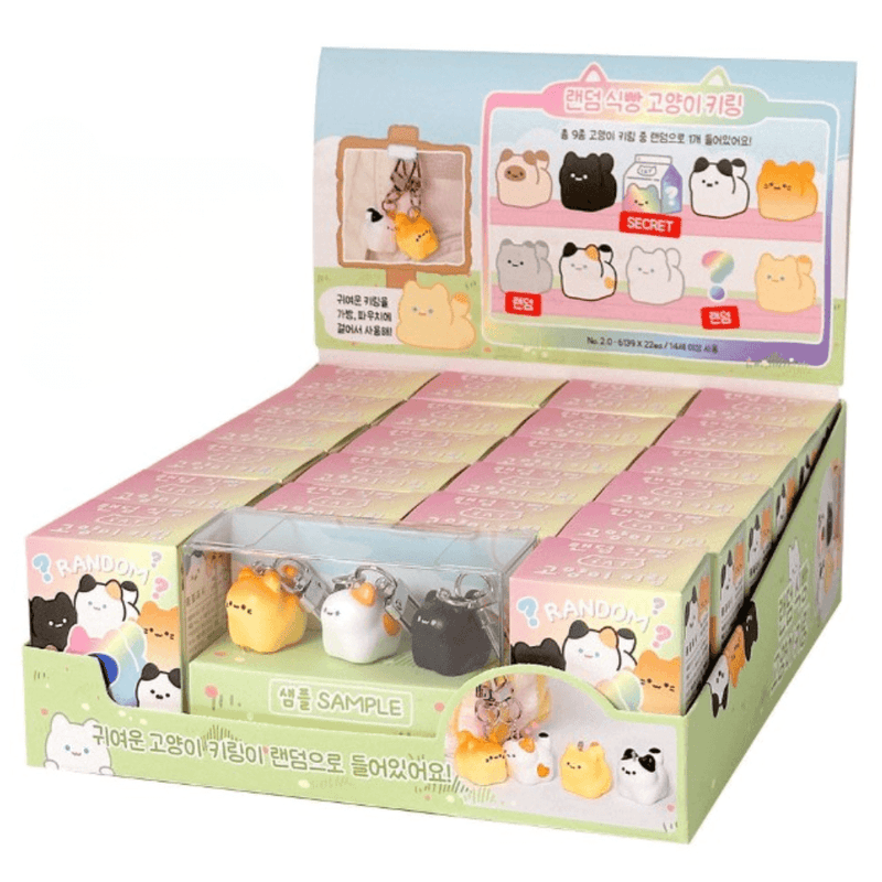 Kawaii Bread Cat Keychain Mystery Blind Box counter display with boxed keychains and sample charms