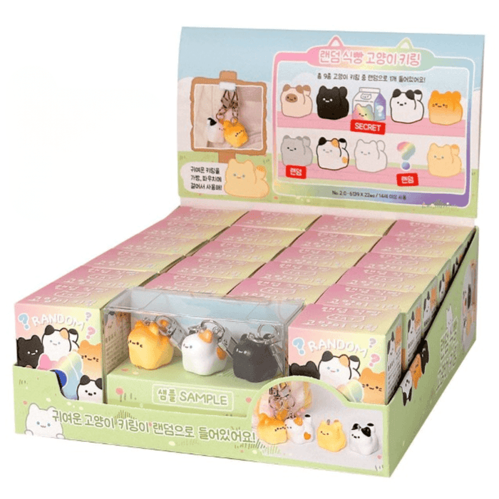Kawaii Bread Cat Keychain Mystery Blind Box counter display with boxed keychains and sample charms
