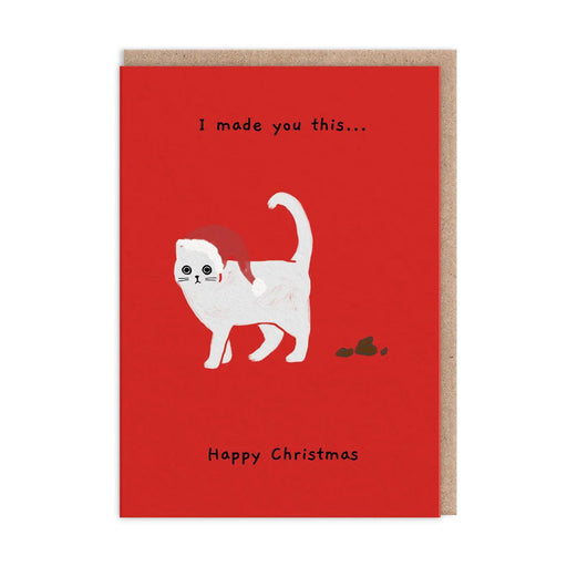 Red Christmas card with white cat in a Santa hat beside a “gift”; text reads “I made you this… Happy Christmas”; A6, blank inside, brown kraft envelope by Ken The Cat