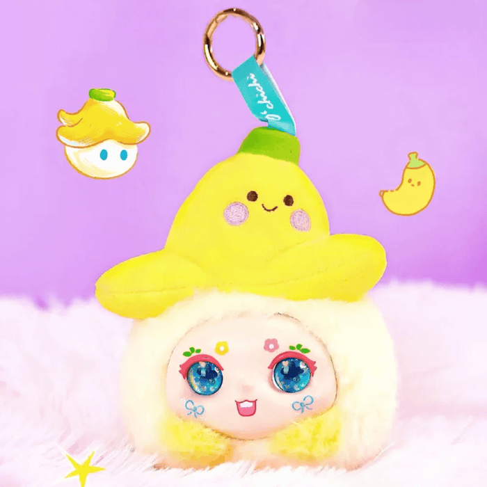 Banana Hat plush – yellow fruit hat on white‑fur character, Kimmon Hat Bubble blind box.
