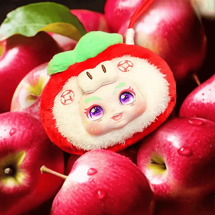 Apple plush blind box collectable – red fruit character with glittery purple eyes.
