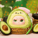 Avocado plush blind box character – green fruit with pit‑hat and pouty face.
