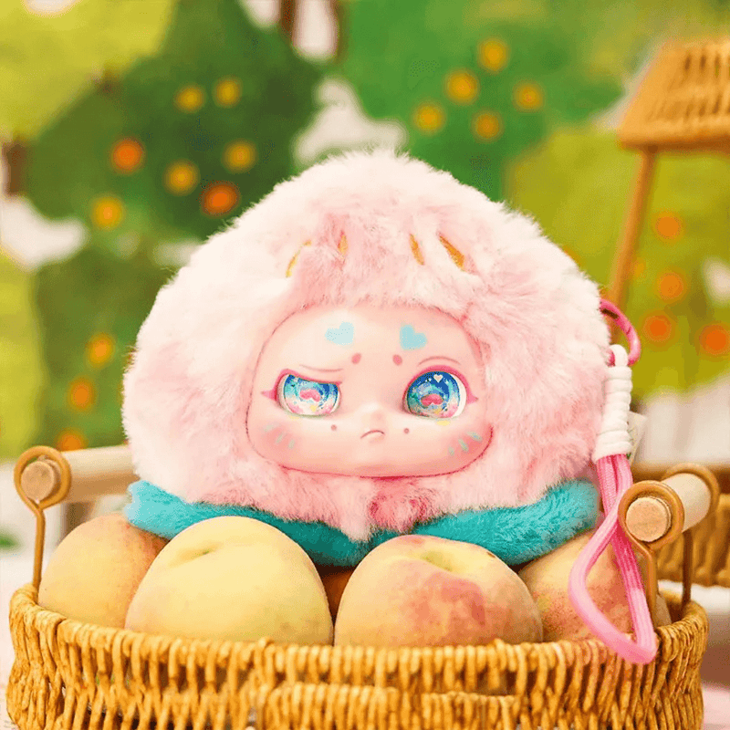 Peach plush collectable – fluffy pink fruit with turquoise scarf, Kimmon blind box.
