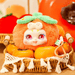 Persimmon plush figure – orange fruit with green leaf top and bright pink eyes.
