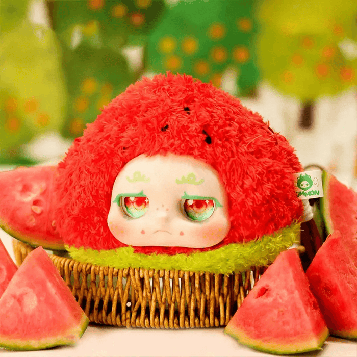 Watermelon plush – red rind, green base, sleepy expression; Kimmon “Sure Enough” collectable.
