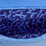 Coordinating lining detail inside the Loungefly KPop Demon Hunters Derpy bag